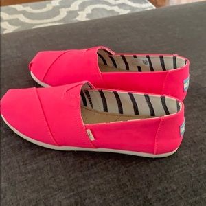 Brand new Toms hot pink shoes.